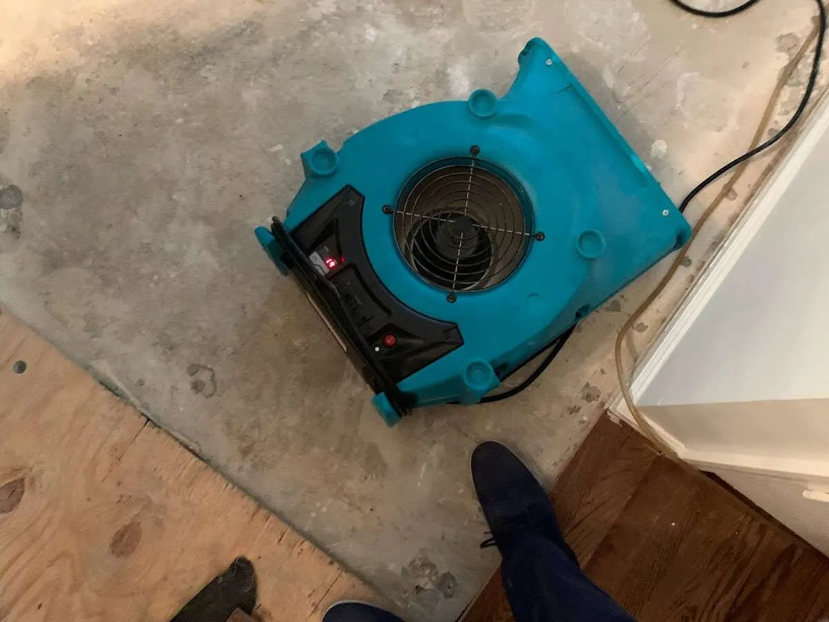 Air mover drying subfloor during Leak Detection & Repair in Cullowhee